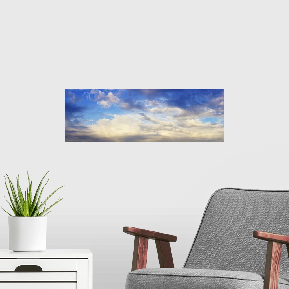 A modern room featuring Panoramic view of cloudy sky.