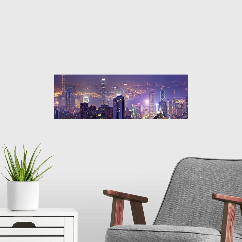 A modern room featuring China, Hong Kong, Hong Kong island, City skyline with the Victoria Harbor, view from Victoria Pea...
