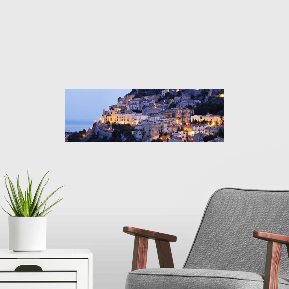 A modern room featuring Italy, Calabria, Mediterranean sea, Tyrrhenian coast, Cosenza district, Amantea, Old town at night