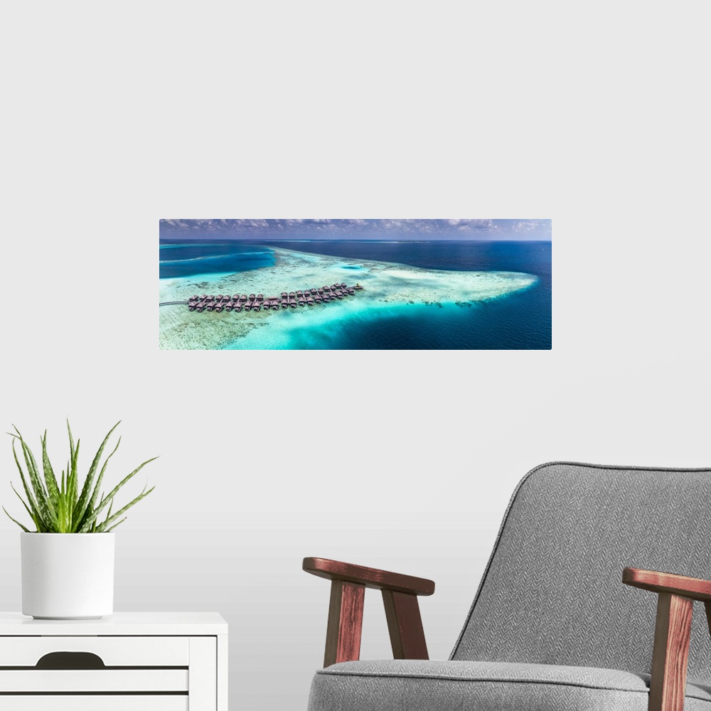 A modern room featuring Maldives, Ari Atoll, Indian ocean, South Alifu Atoll, breathtaking aerial view of Moofushi reef a...