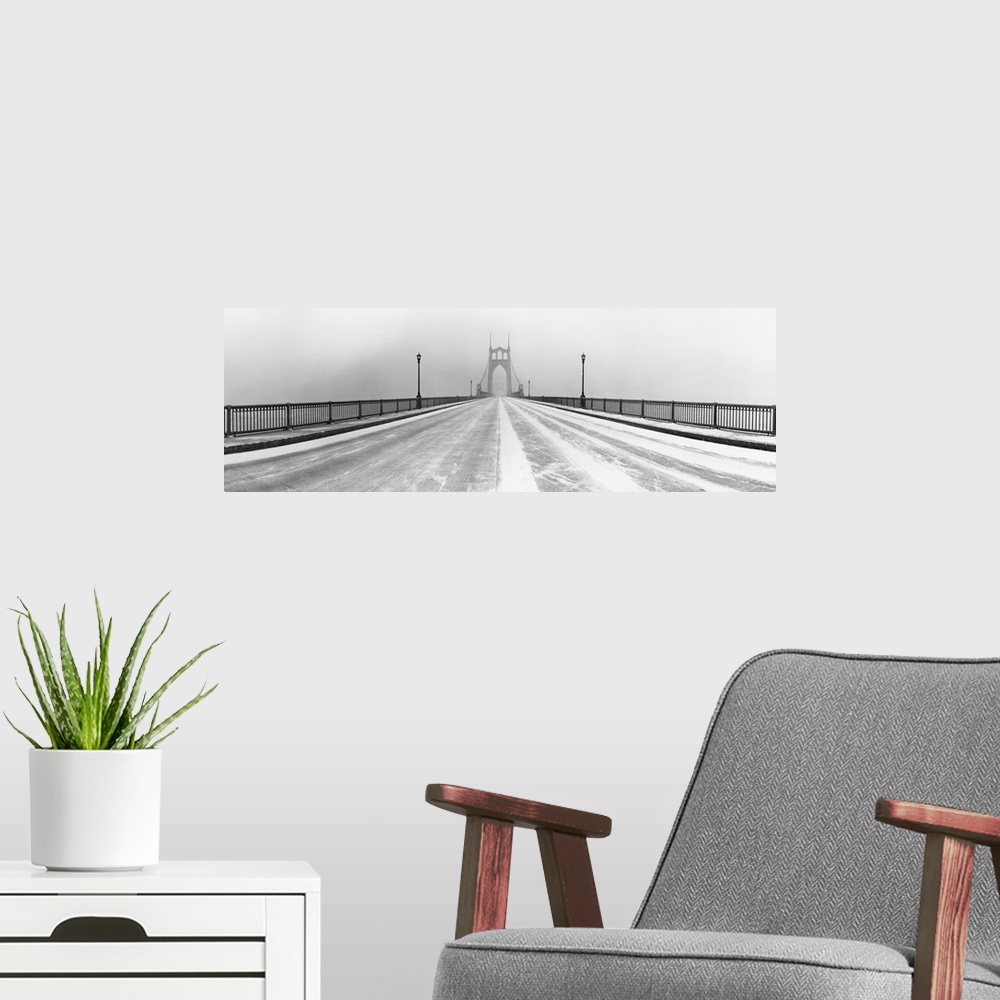 A modern room featuring Black and white panorama of St.Johns Bridge in Portland, Oregon in winter snow storm.