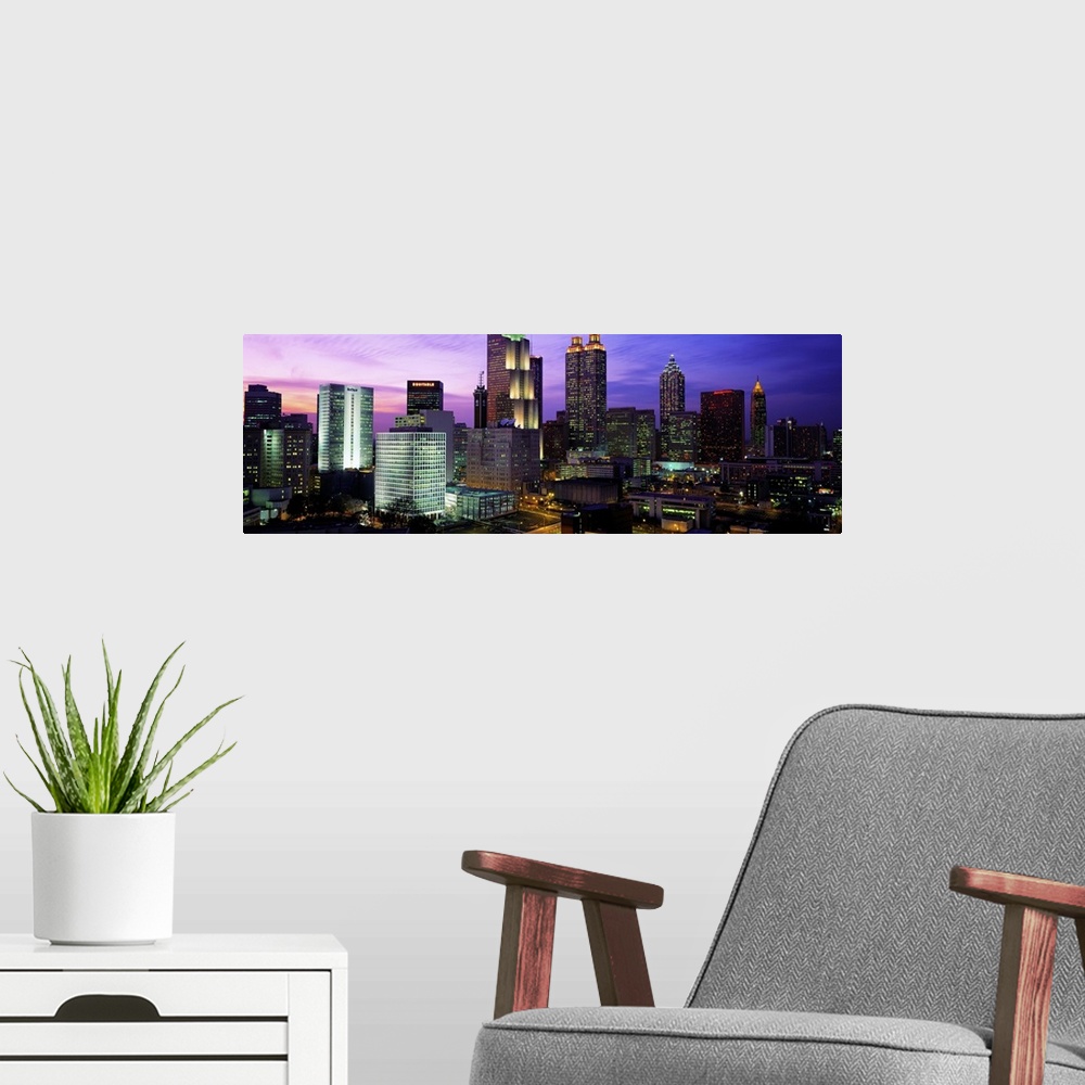A modern room featuring USA, Georgia, Atlanta, skyline at night