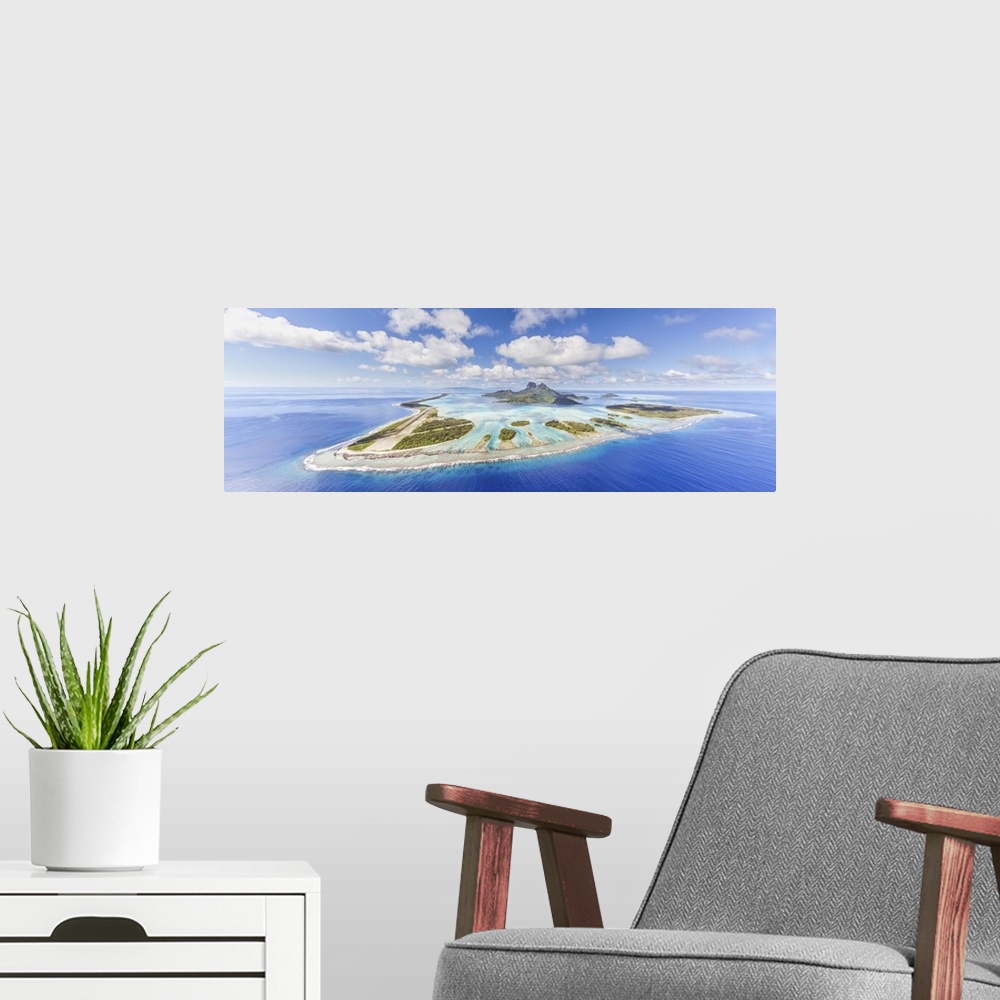A modern room featuring Aerial view of Bora Bora island with airstrip visible, French Polynesia.