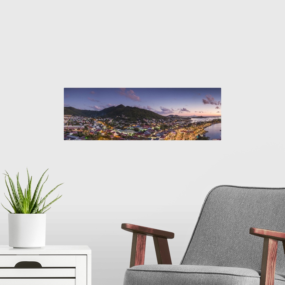 A modern room featuring French West Indies, St-Martin, Marigot from Fort Louis, dusk