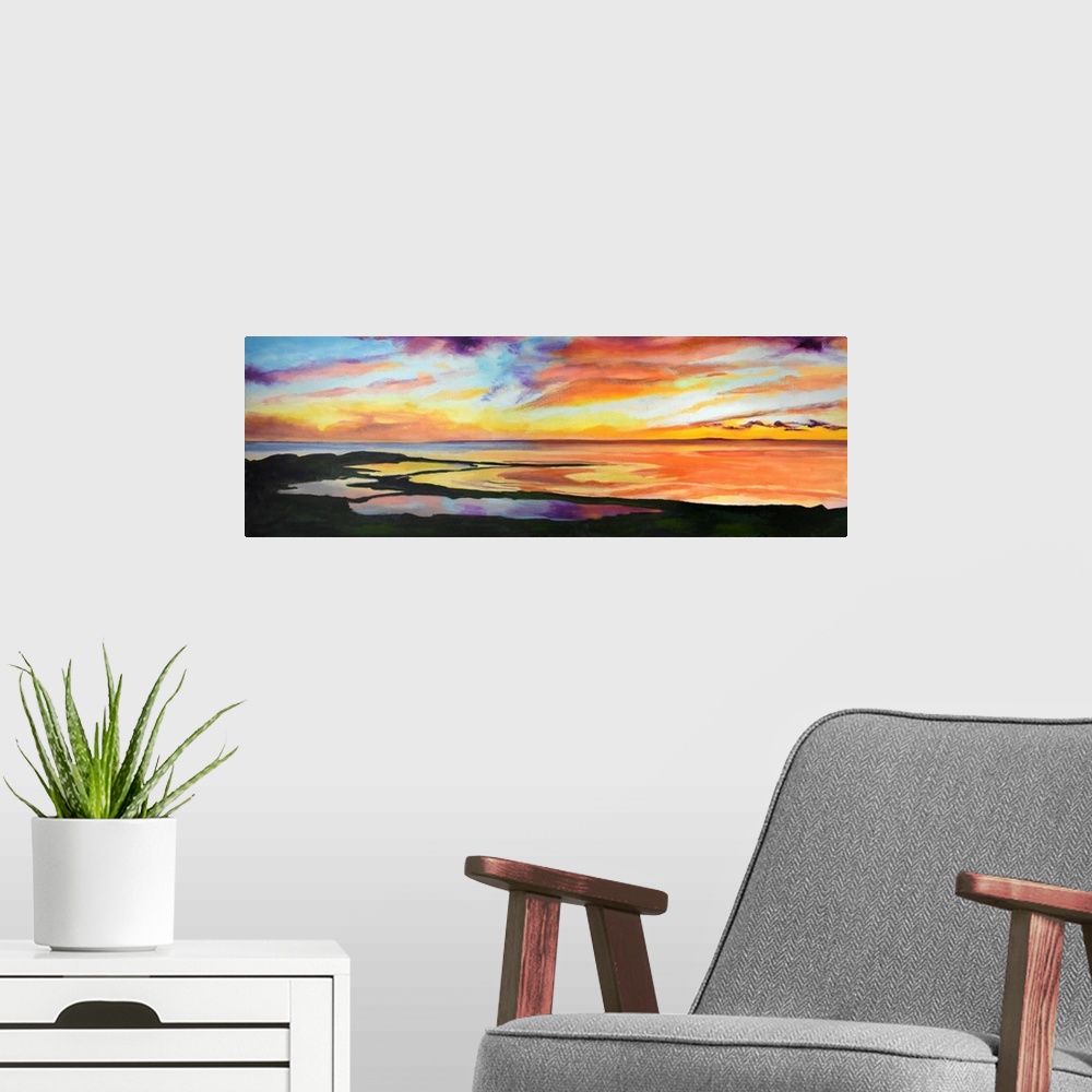 A modern room featuring Coastal scene with golden sky and reflections in the water.