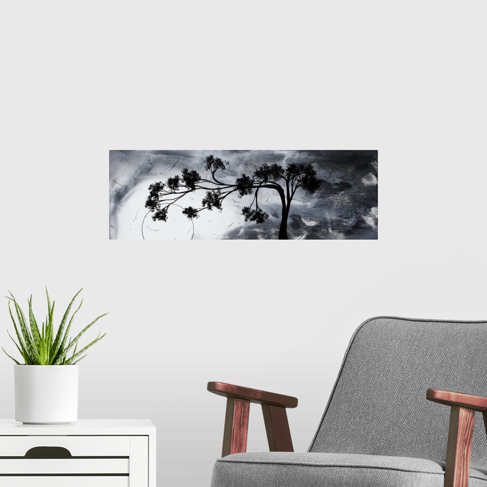 A modern room featuring Abstract artwork of a silhouetted tree that reaches far to the left against a gloomy sky with sev...