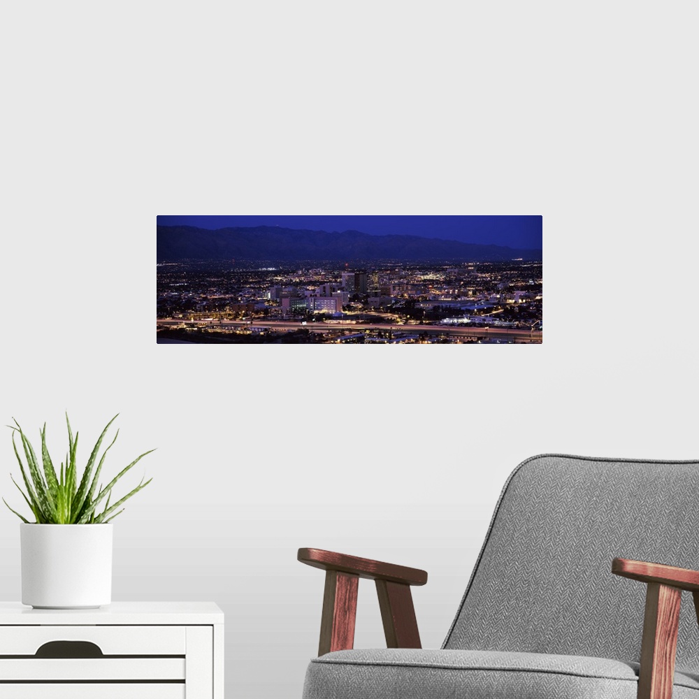 A modern room featuring Aerial view of a city at night Tucson Pima County Arizona