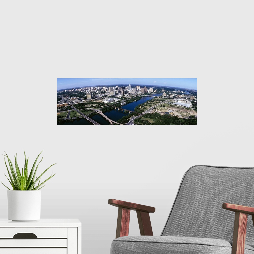 A modern room featuring Wide photo from above of the city of Austin, Texas and the Colorado River.