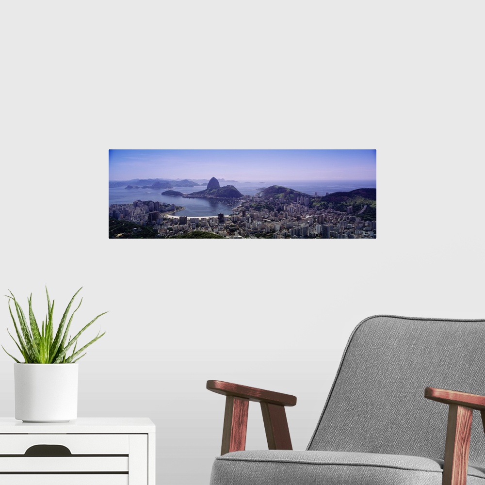 A modern room featuring Panoramic photo from above of the city of Rio De Janeiro in Brazil.