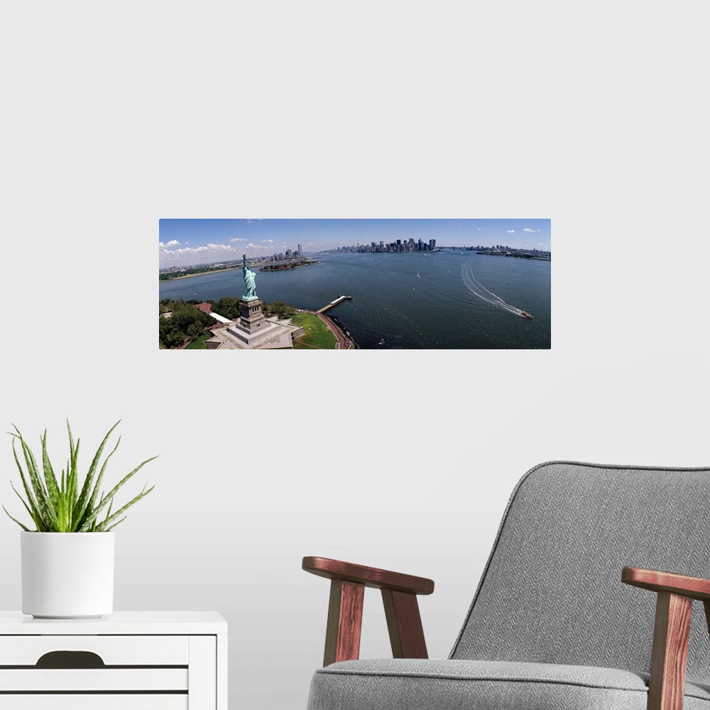 A modern room featuring Panoramic photograph of iconic "Big Apple" monument and waterfront under a cloudy sky.