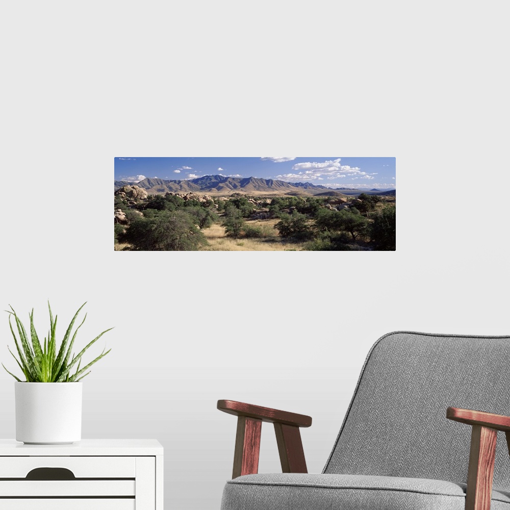 A modern room featuring Arizona, Texas Valley, Dragoon Mountains, Clouded sky over arid landscape