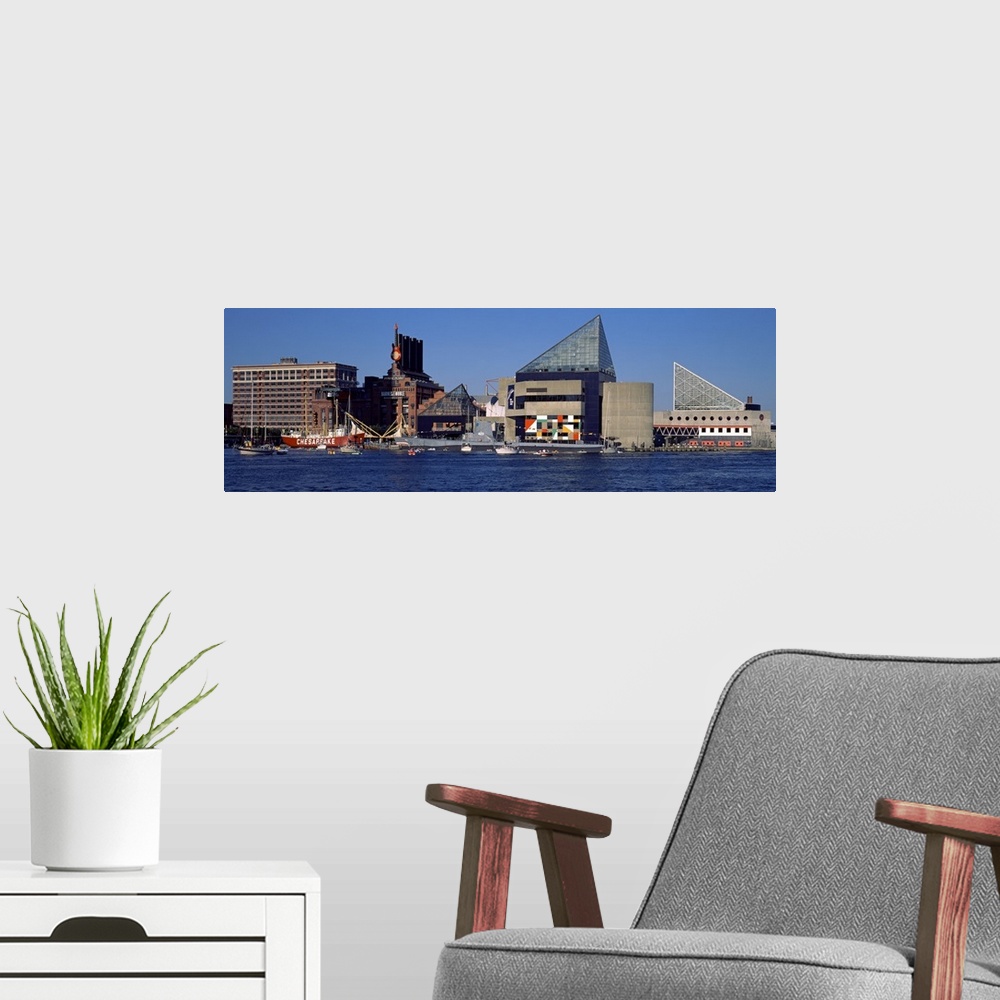 A modern room featuring Buildings in Baltimore are photographed in wide angle view from across the waterfront.