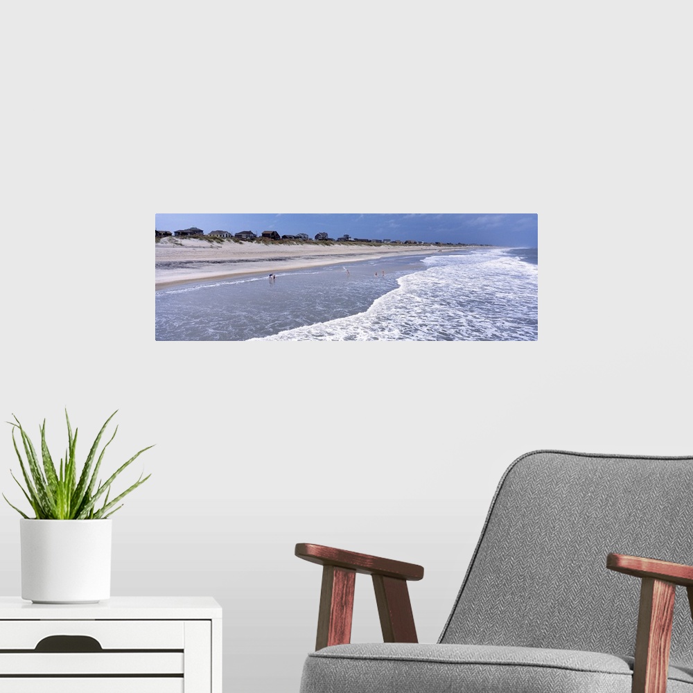 A modern room featuring Landscape, large photograph of the shoreline at an angle on Hatteras Beach in North Carolina.  A ...