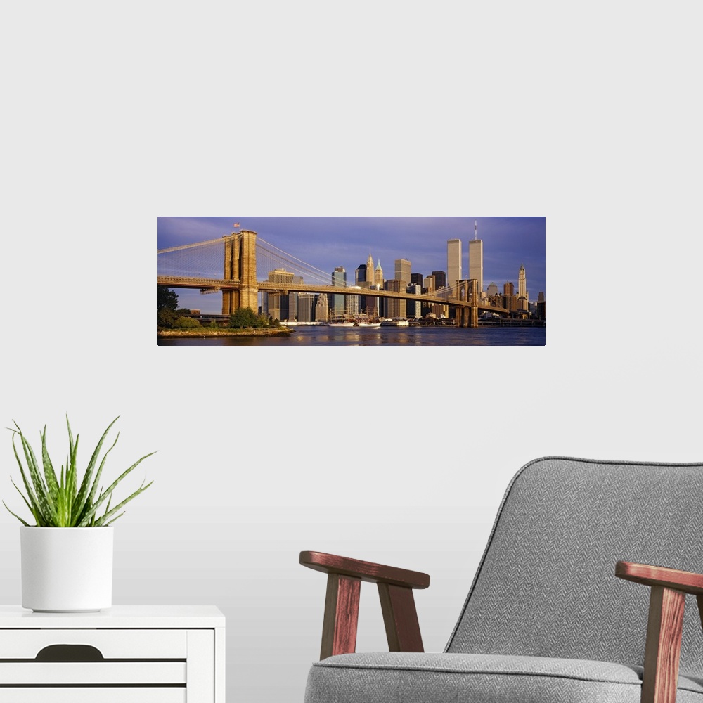 A modern room featuring Panoramic, giant photograph of the Brooklyn Bridge in the sunlight, the New York City skyline in ...