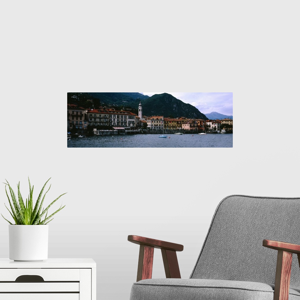A modern room featuring Buildings at the lakeside viewed from a ferry, Lake Como, Menaggio, Como, Lombardy, Italy