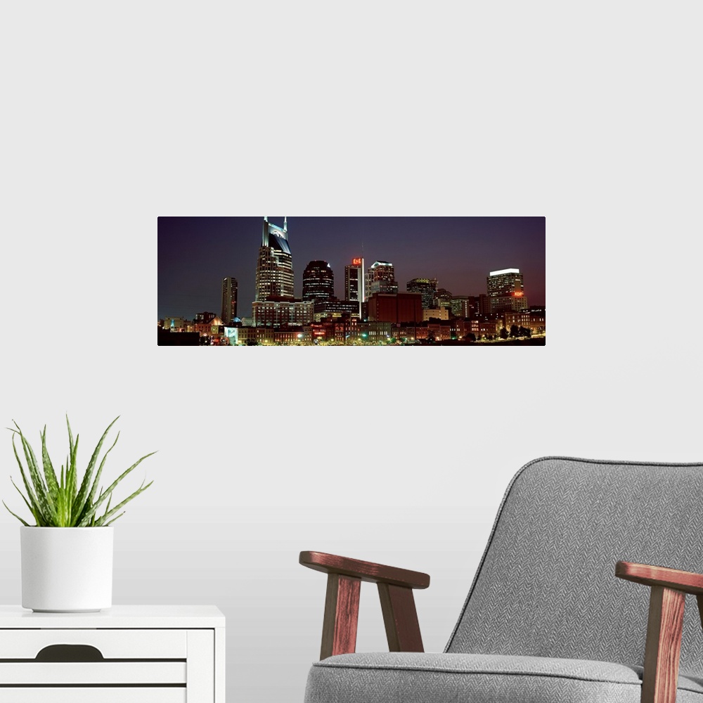 A modern room featuring Panoramic wall art for the home or office of high rise buildings in the Nashville skyline at night.
