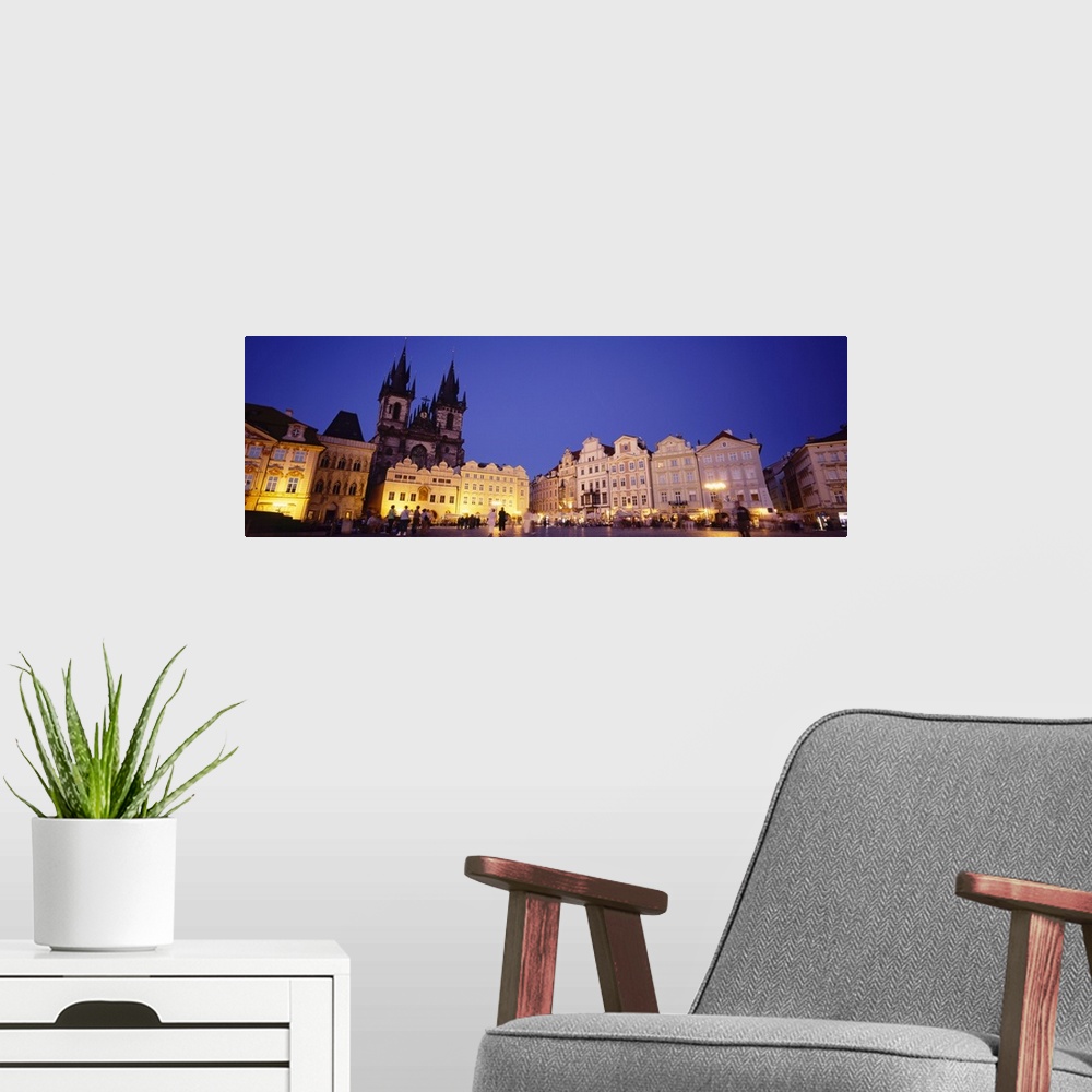 A modern room featuring Buildings lit up at dusk, Prague Old Town Square, Old Town, Prague, Czech Republic