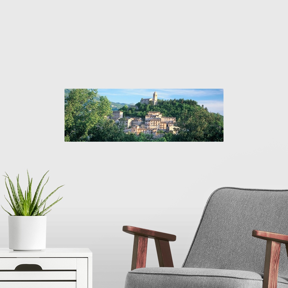A modern room featuring Buildings surrounded by trees, Montefortino, Province of Ascoli Piceno, Marches, Italy