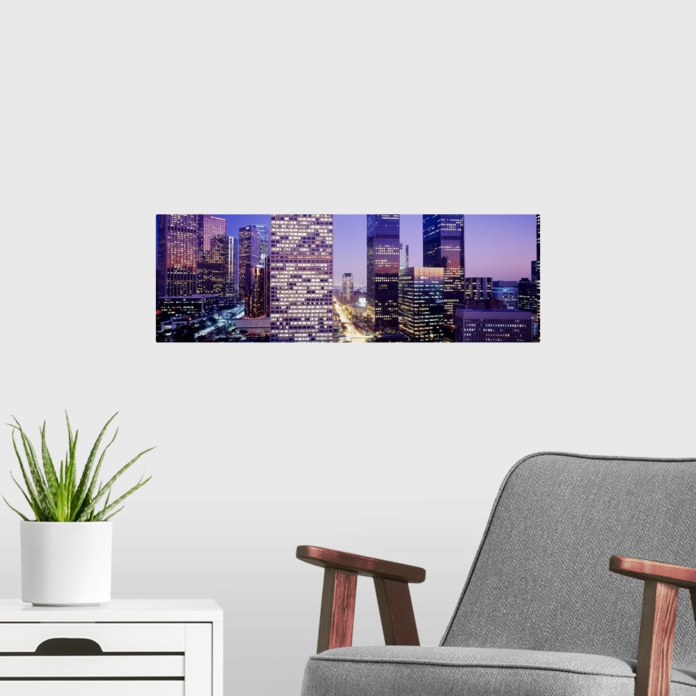A modern room featuring Big photo on canvas of an up close view of buildings in downtown LA.