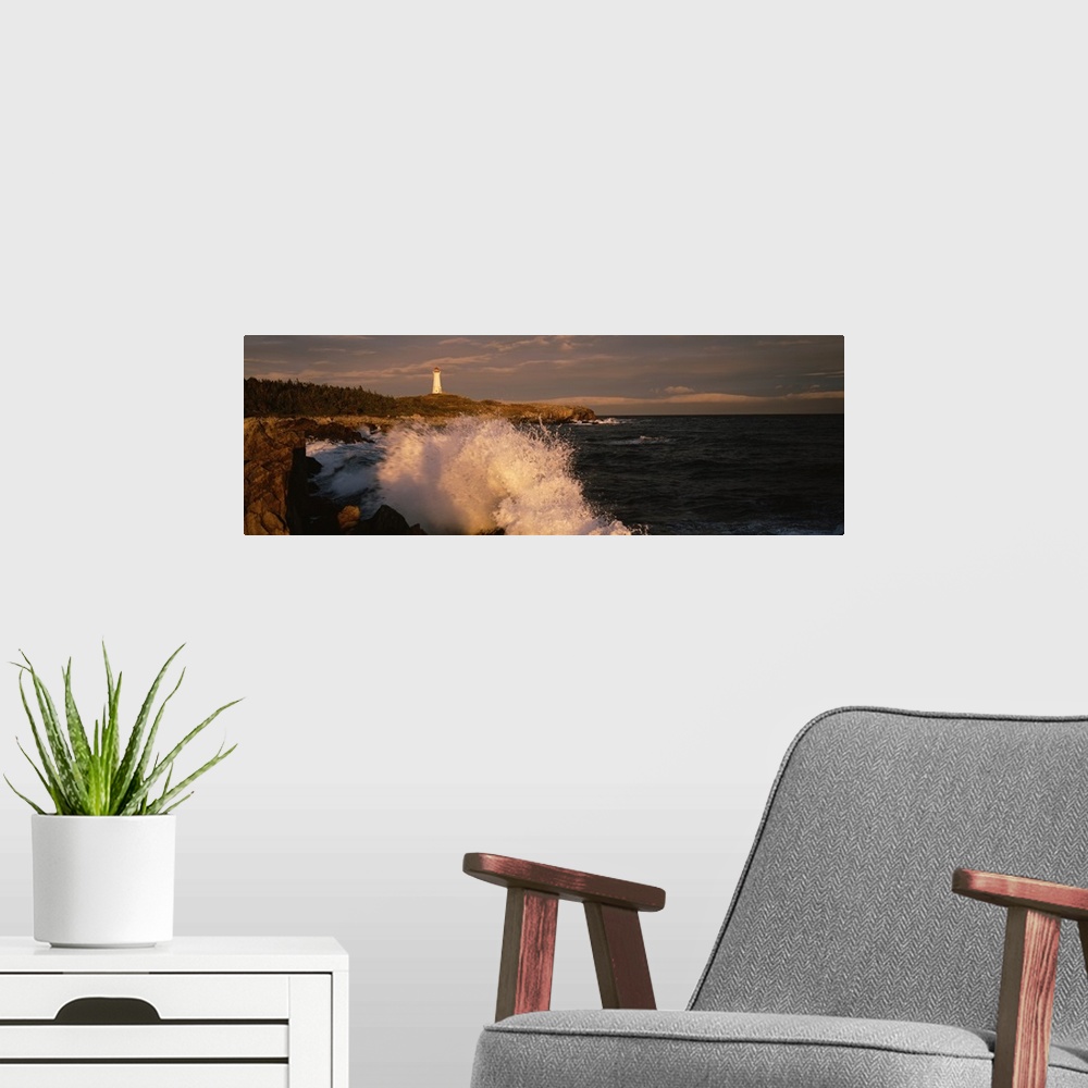 A modern room featuring Canada, Nova Scotia, Cape Breton Island, Waves breaking on the rocks near Louisbourg lighthouse