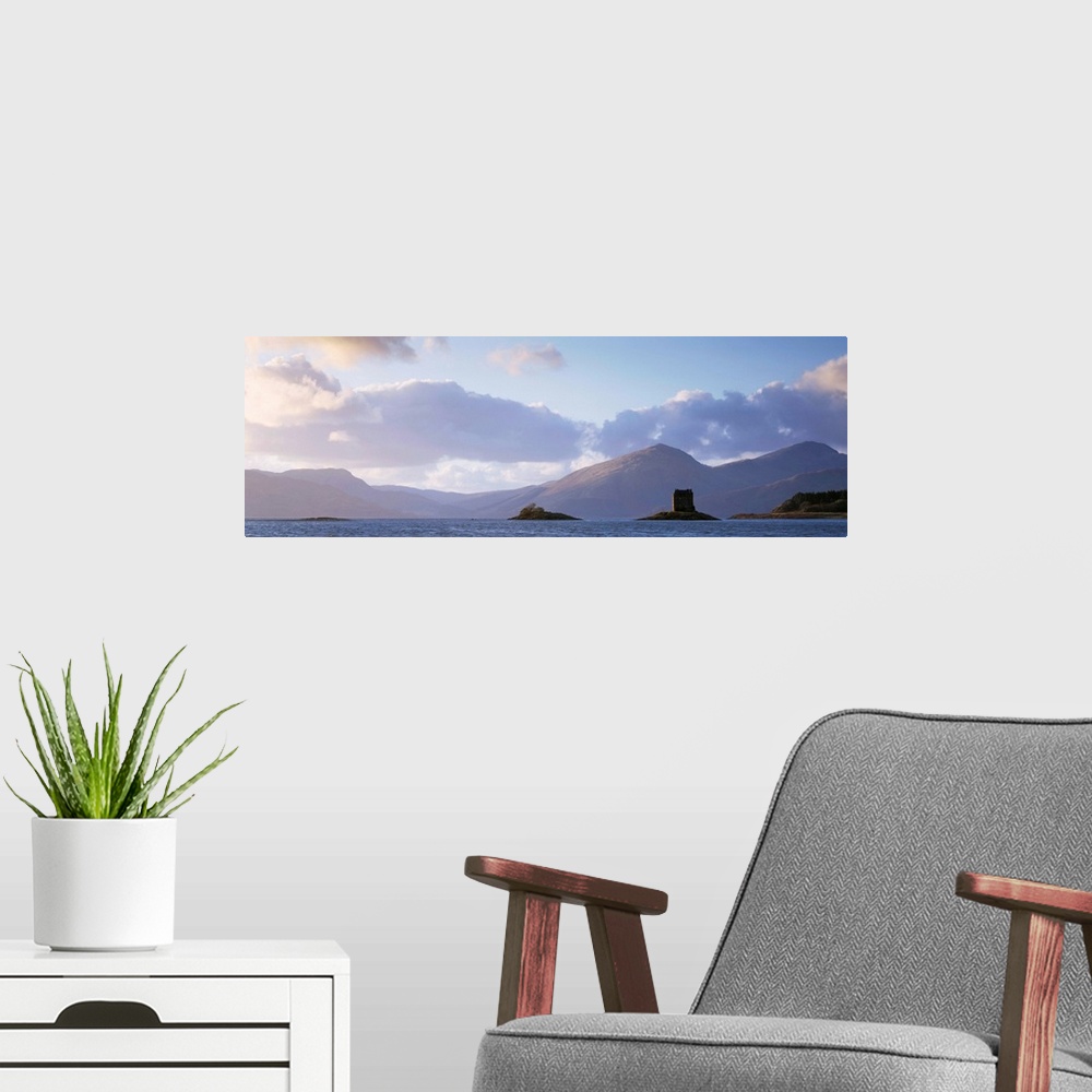 A modern room featuring Castle at dusk with mountains in the background, Castle Stalker, Argyll, Scotland