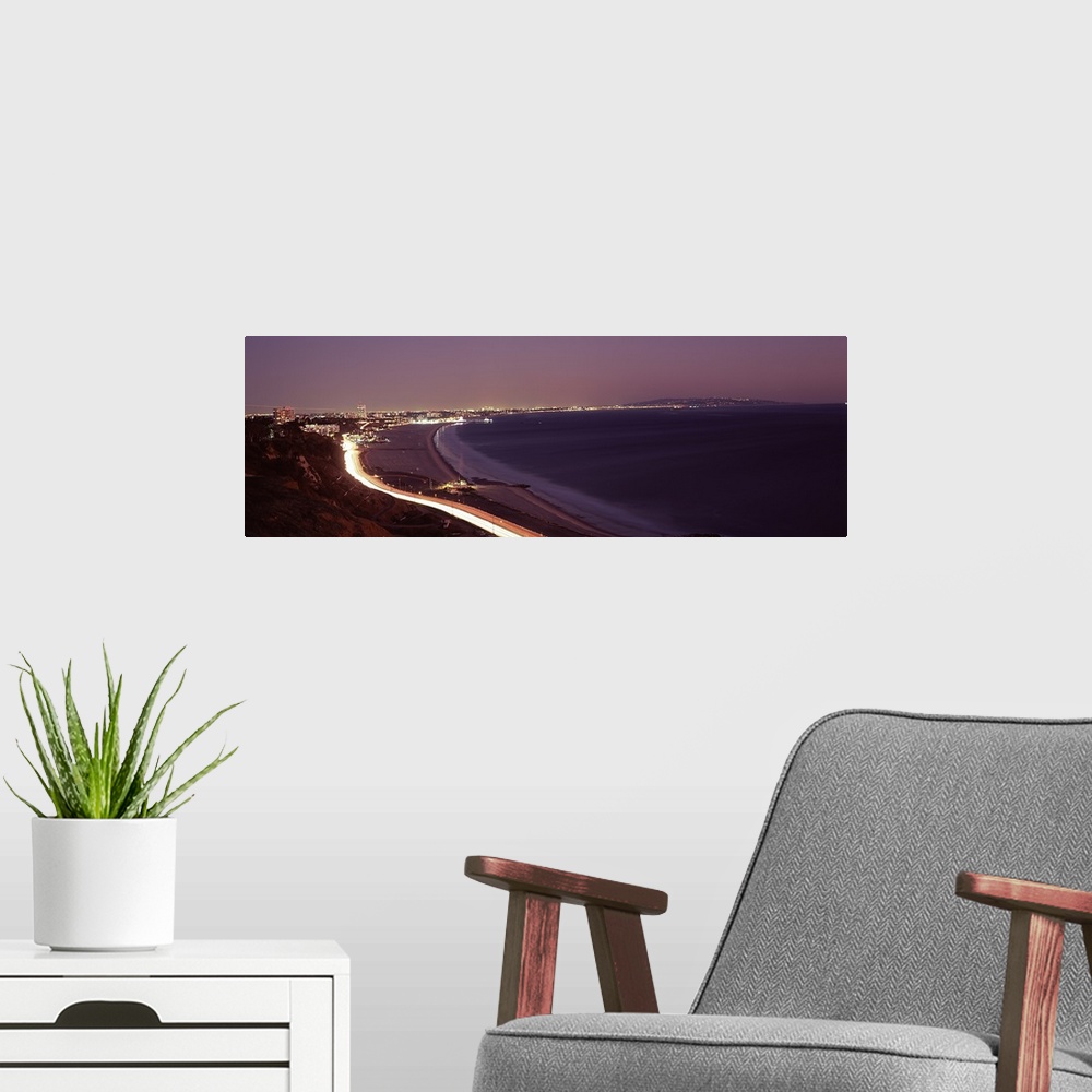 A modern room featuring City lit up at night, Highway 101, Santa Monica, Los Angeles County, California, USA