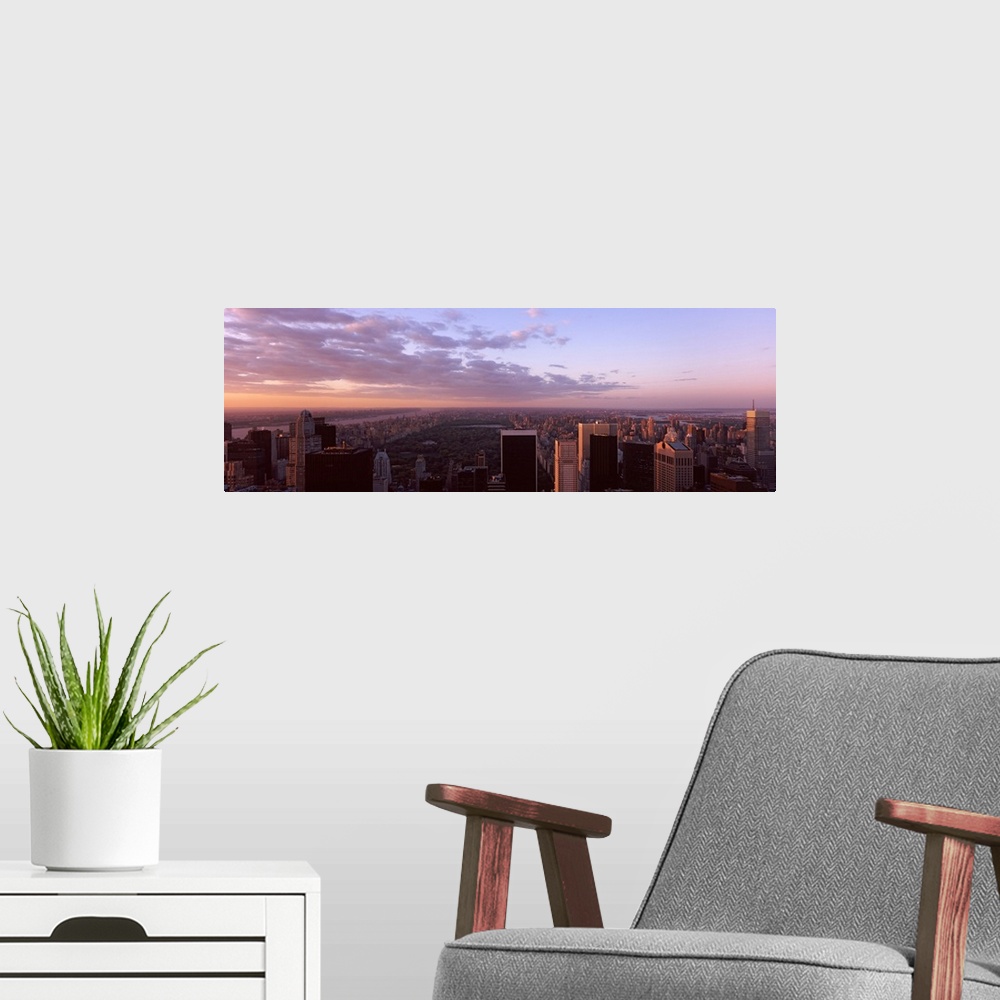 A modern room featuring Panoramic photograph of the New York City skyline showing Central Park just behind the buildings ...