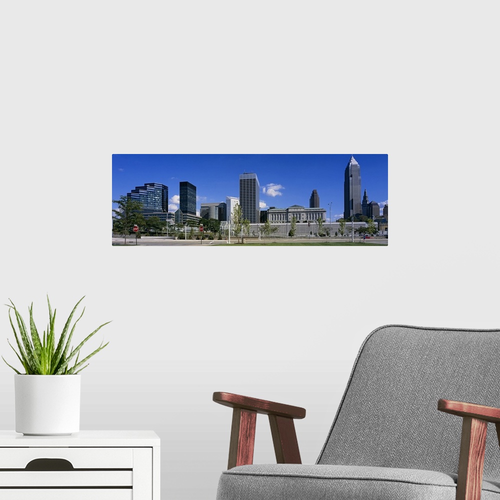 A modern room featuring Panoramic photograph taken of the Cleveland skyline on a bright sunny day.
