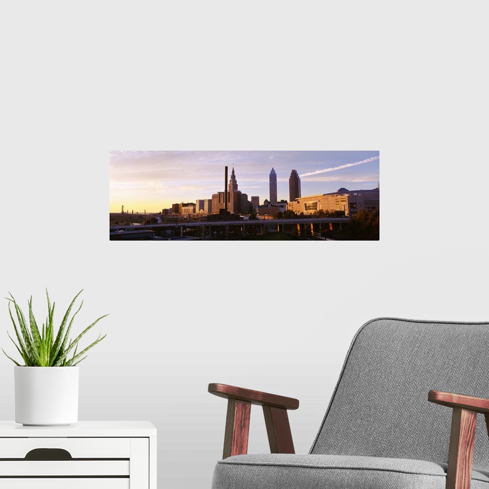 A modern room featuring Cleveland Ohio city skyline at dusk