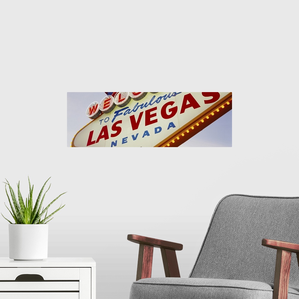 A modern room featuring Panoramic photo of a close up of the classic Las Vegas sign.