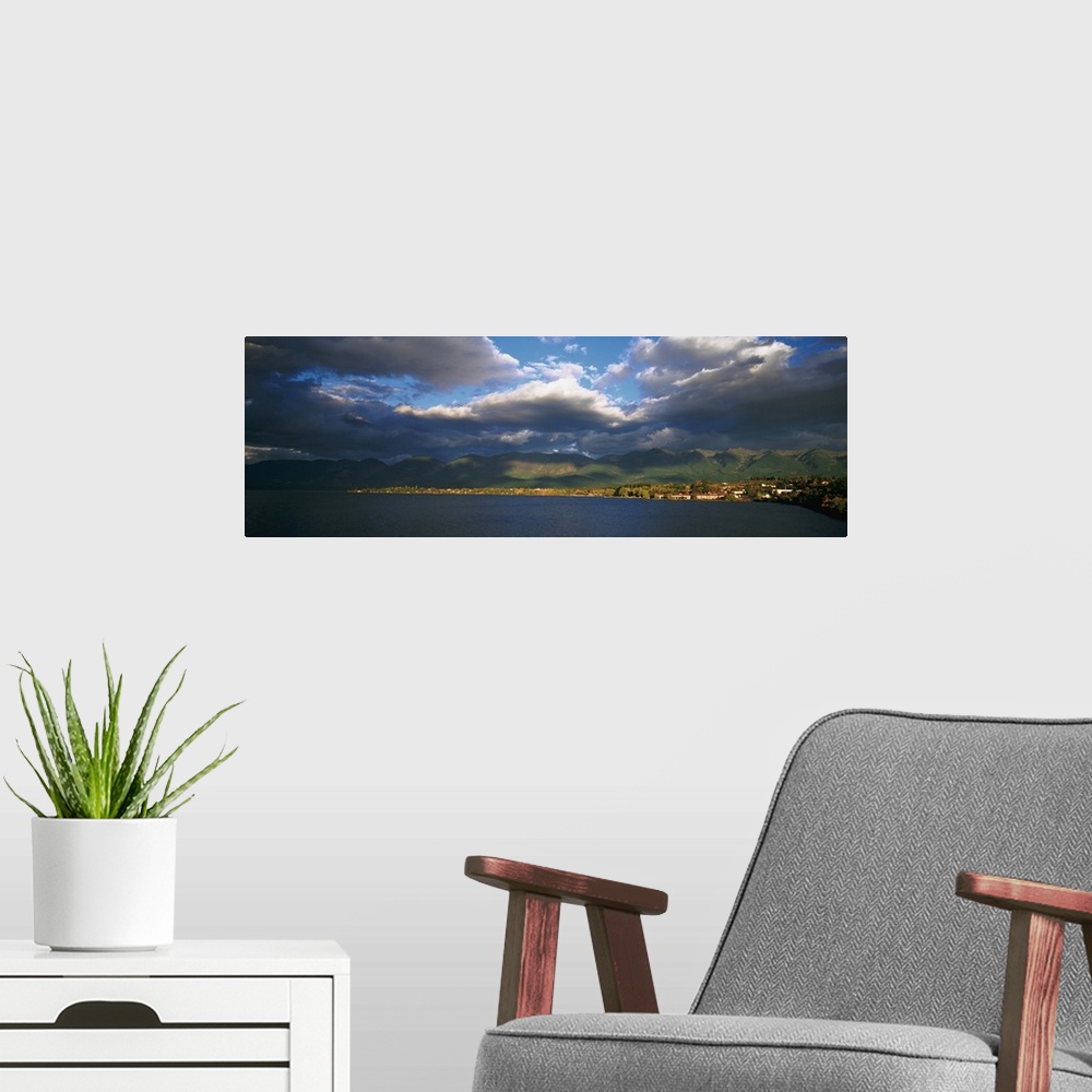 A modern room featuring Clouded sky over a lake, Flathead Lake, Swan Range, Polson, Montana