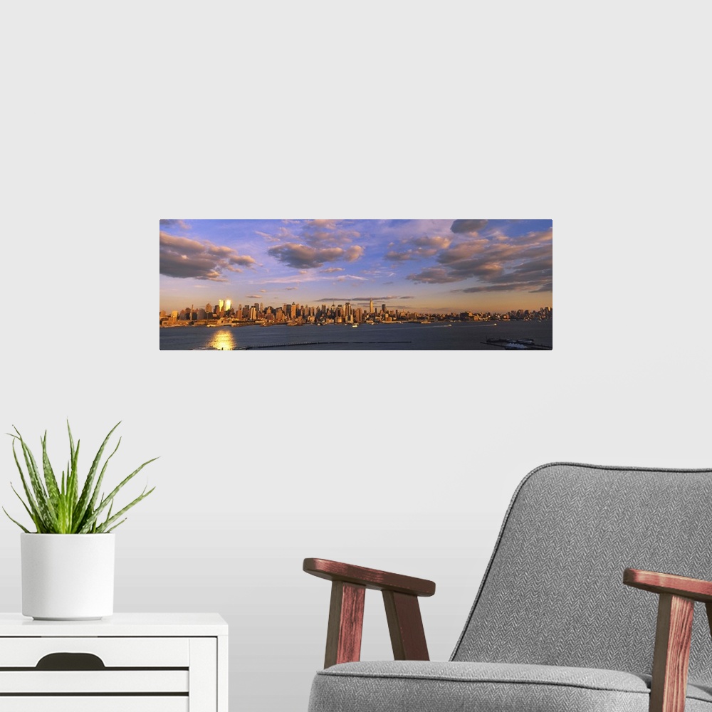A modern room featuring Clouds over a city at sunset, Manhattan, New York City, New York State