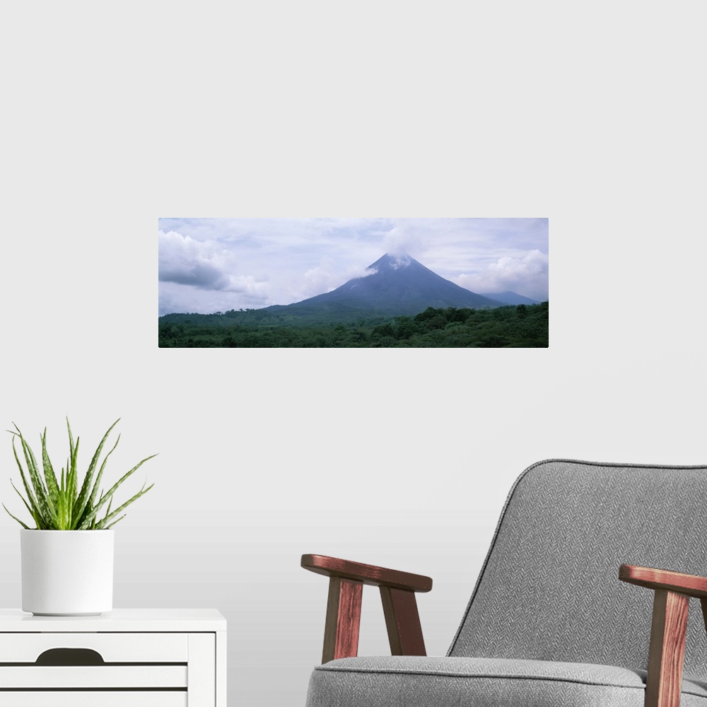 A modern room featuring Clouds over a mountain peak Arenal Volcano Alajuela Province Costa Rica