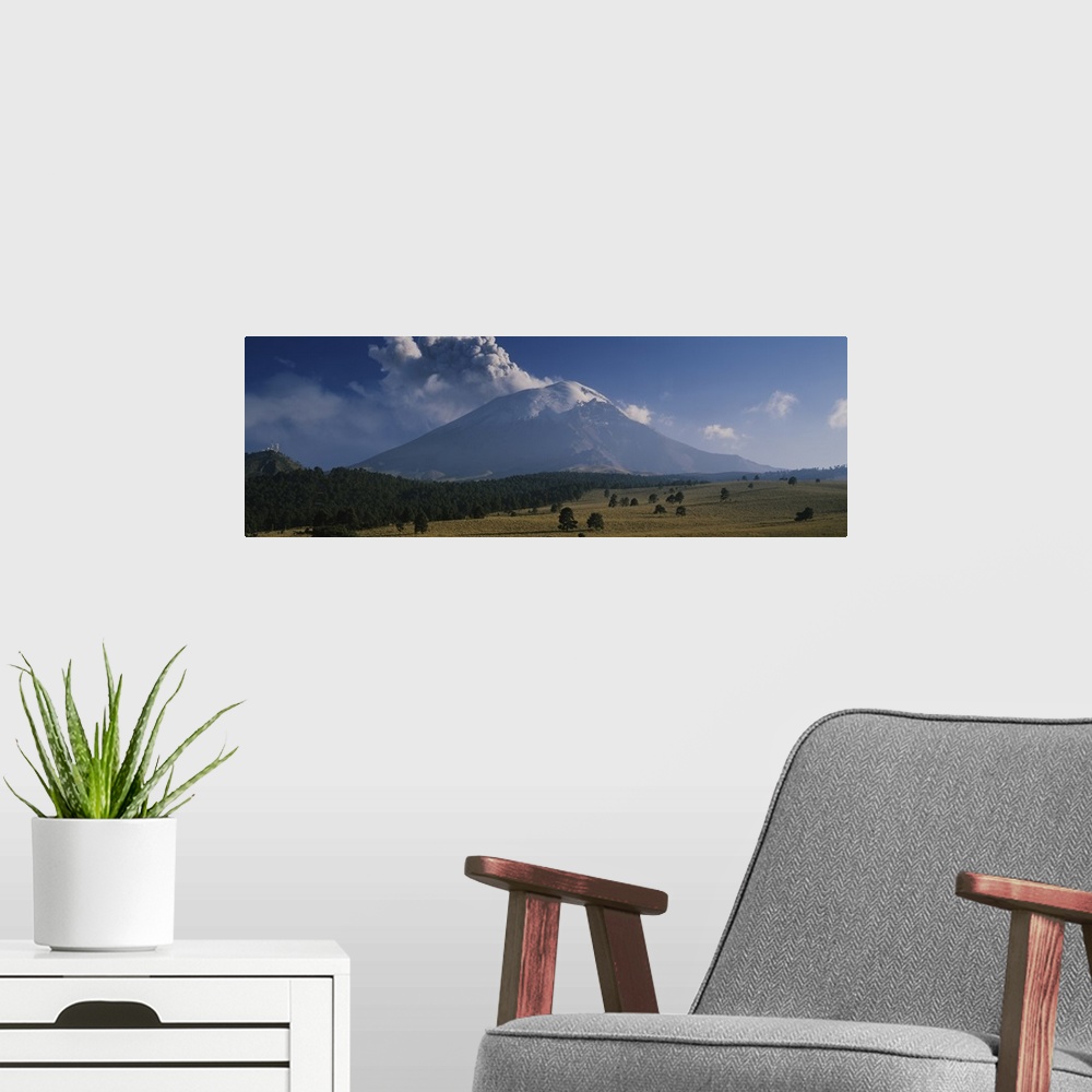 A modern room featuring Clouds over a mountain, Popocatepetl Volcano, Mexico