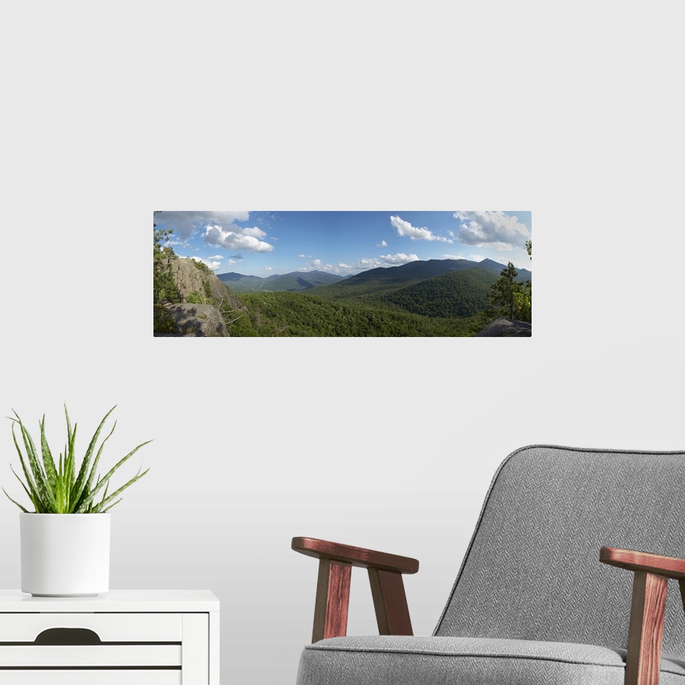 A modern room featuring Clouds over a mountain range, Adirondack Mountains, New York State