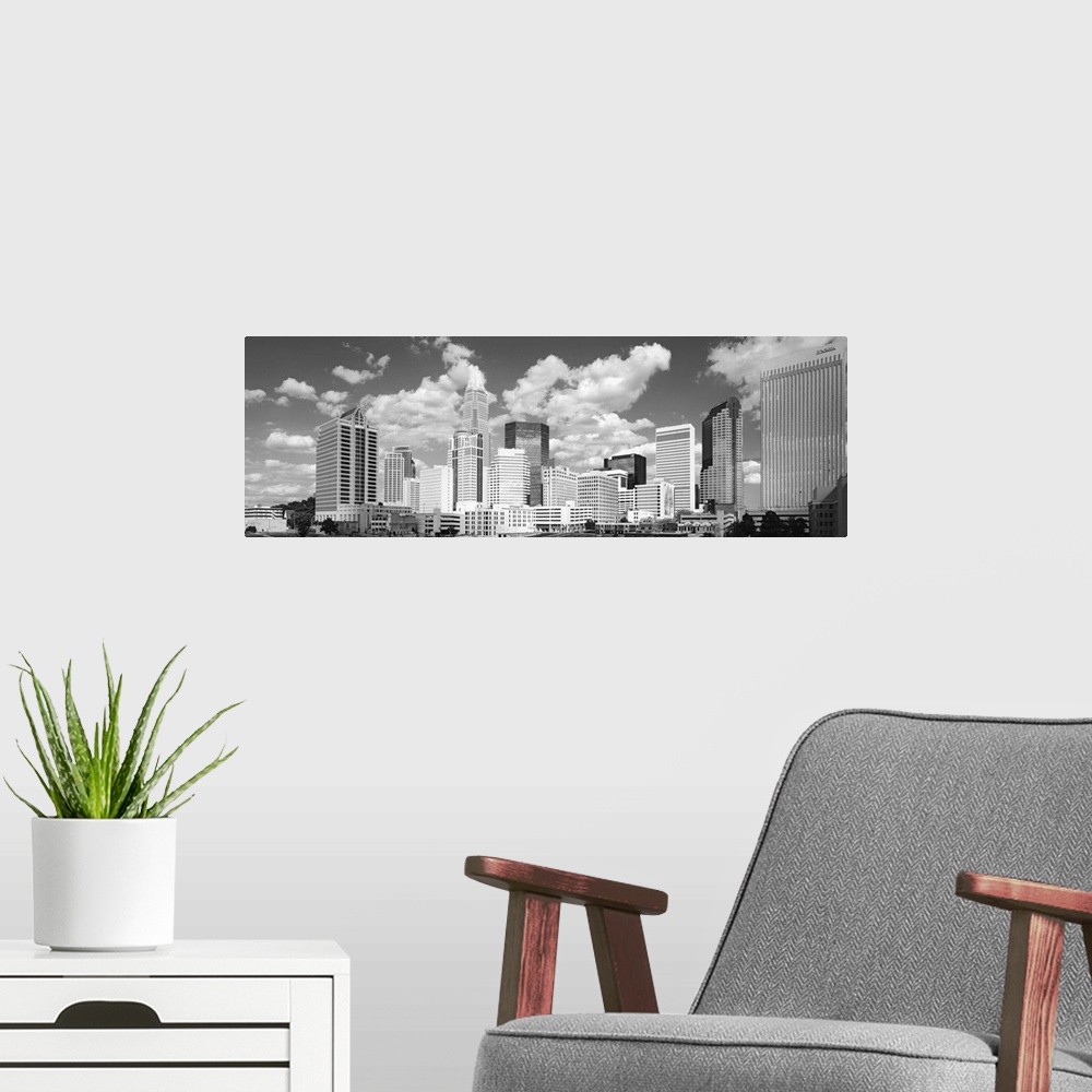 A modern room featuring Black and white photograph of the city skyline of Charlotte, North Carolina.