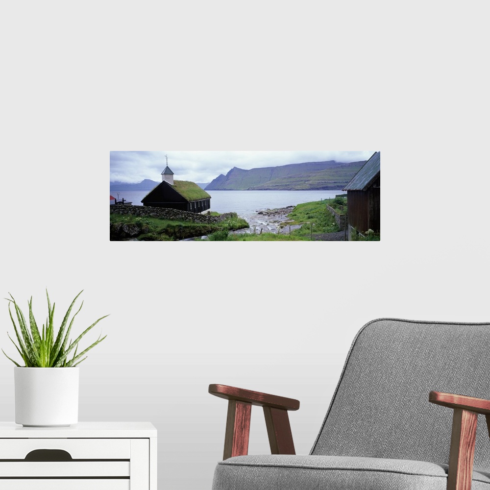 A modern room featuring Coastal church with grass roof, Faroe Islands