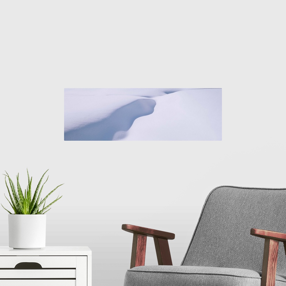 A modern room featuring drifted snow