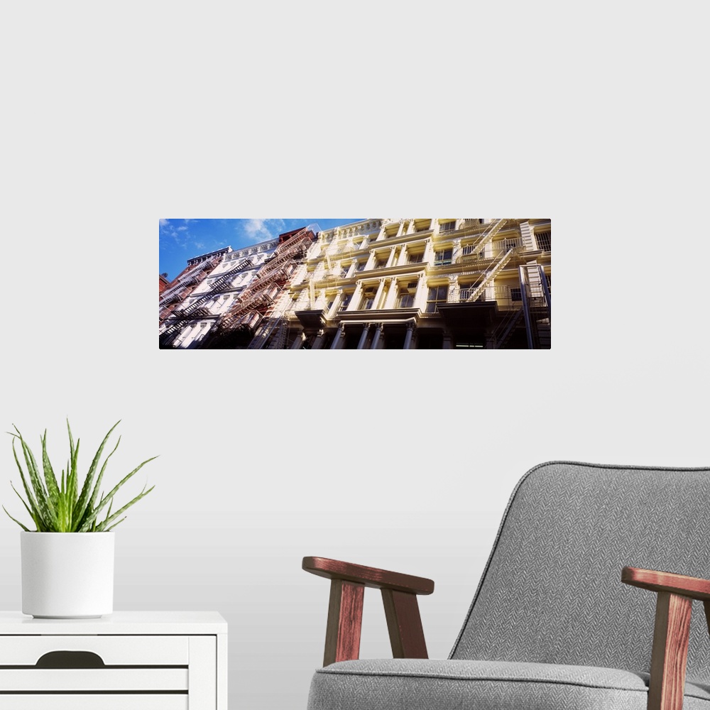 A modern room featuring Up-close panoramic photograph of row houses in The Big Apple.