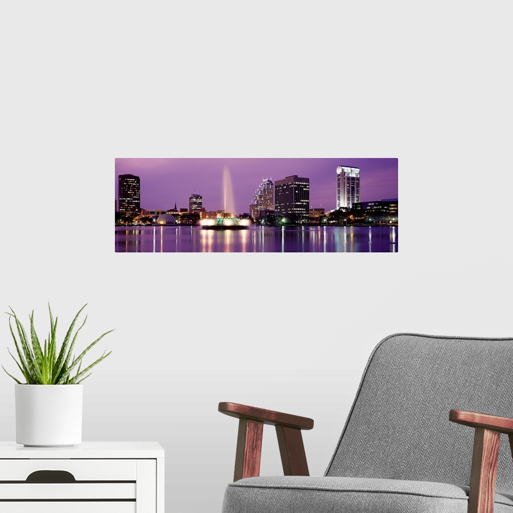 A modern room featuring Florida, Orlando, View of a city skyline at night