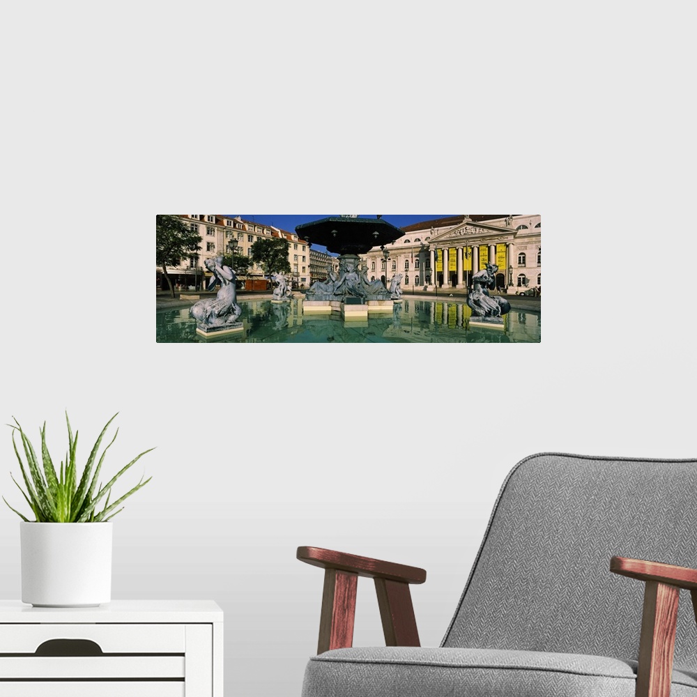 A modern room featuring Fountain in front of an opera house, Praca Rossio, National Theatre Dona Maria II, Lisbon, Portugal