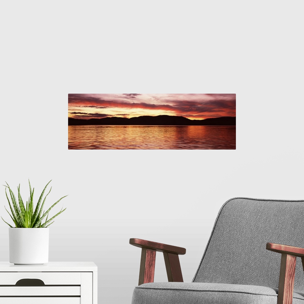 A modern room featuring Sunset over Fourth Lake from Inlet in the Adirondack Mountains, New York