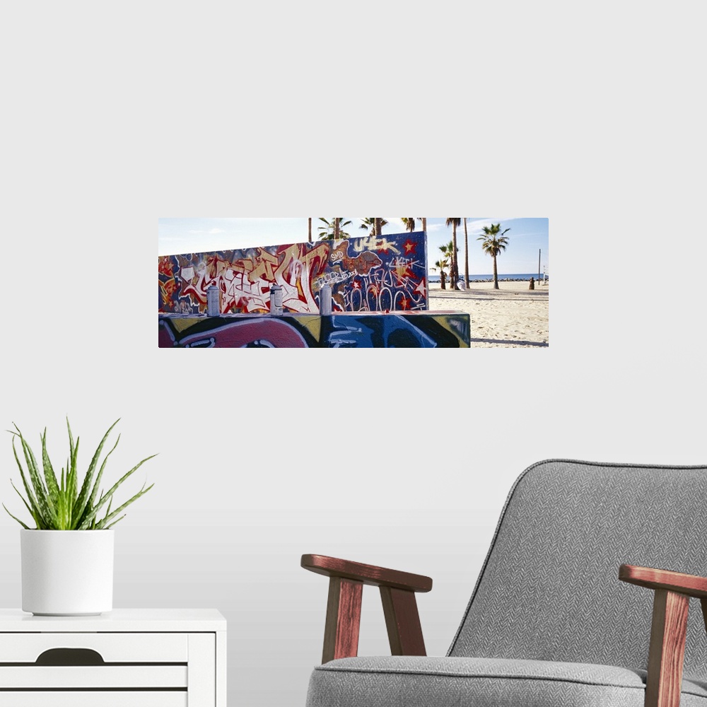 A modern room featuring Horizontal, large photograph of two walls covered with graffiti art in Venice Beach, California. ...