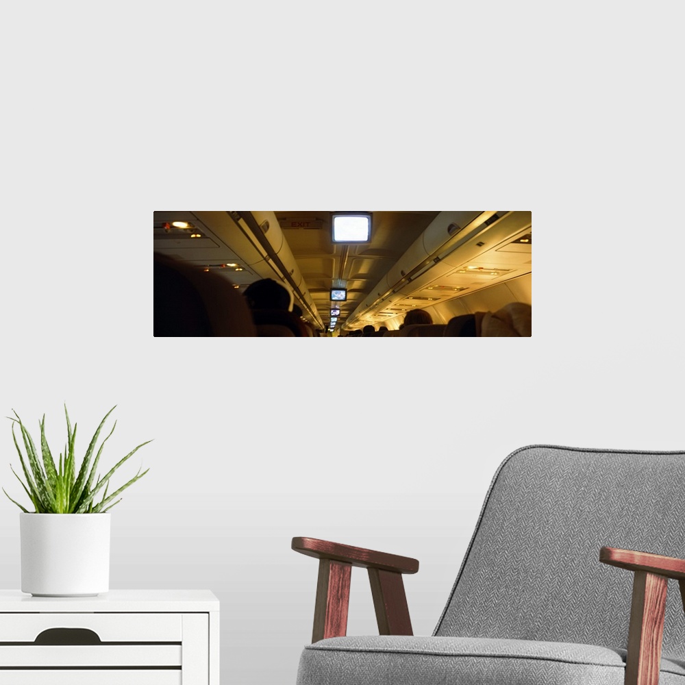 A modern room featuring Group of people traveling in an airplane