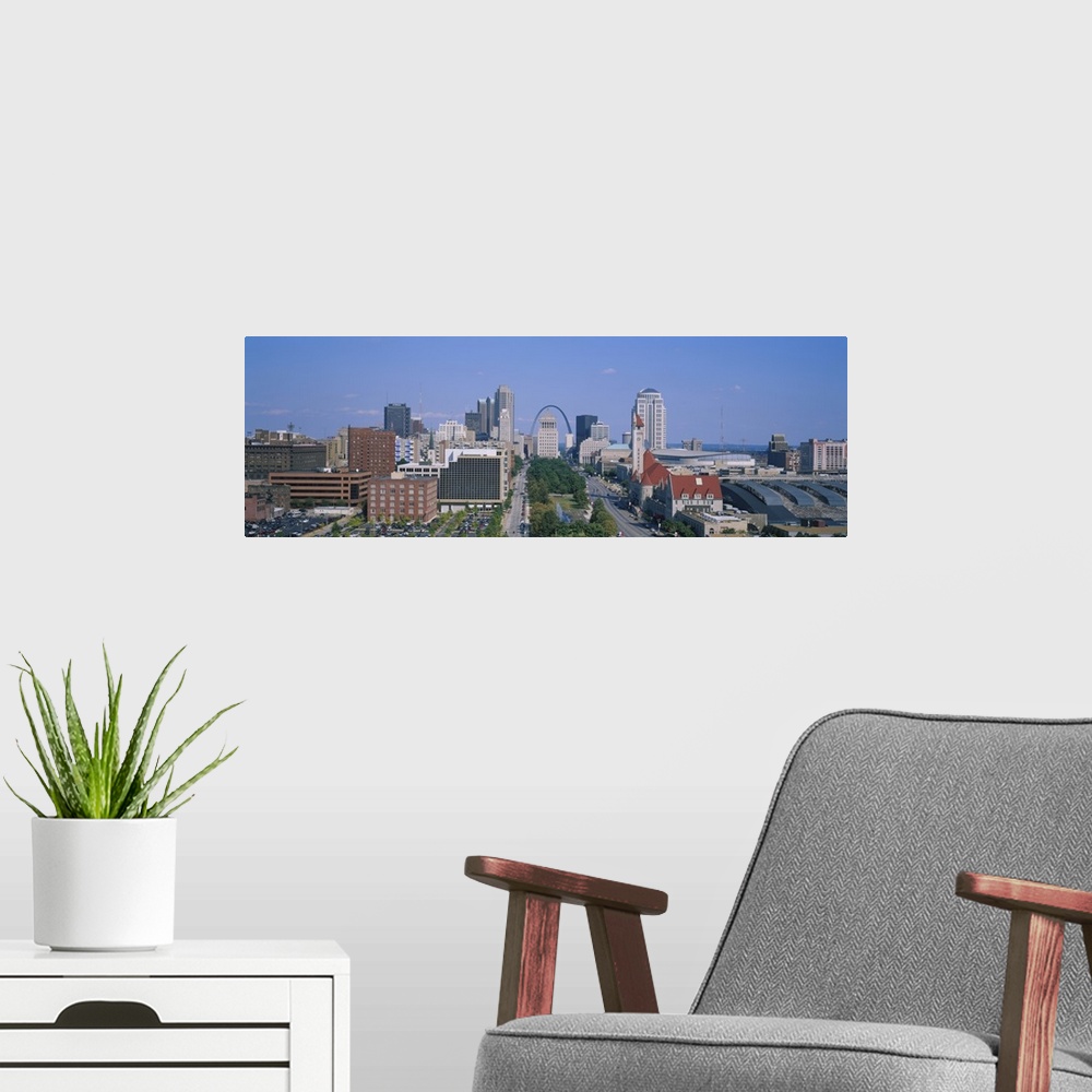 A modern room featuring Panoramic, high angle photograph of the St. Louis skyline during the day, the Gateway Arch can be...