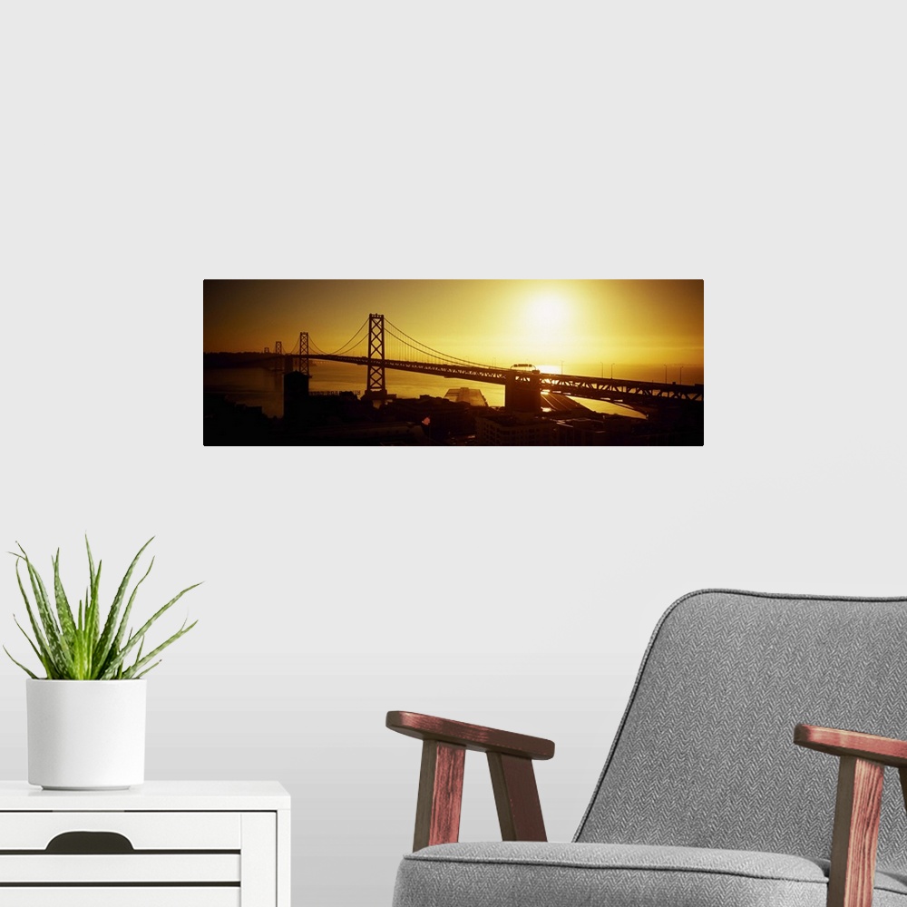 A modern room featuring High angle view of a suspension bridge at sunset, Bay Bridge, San Francisco, California