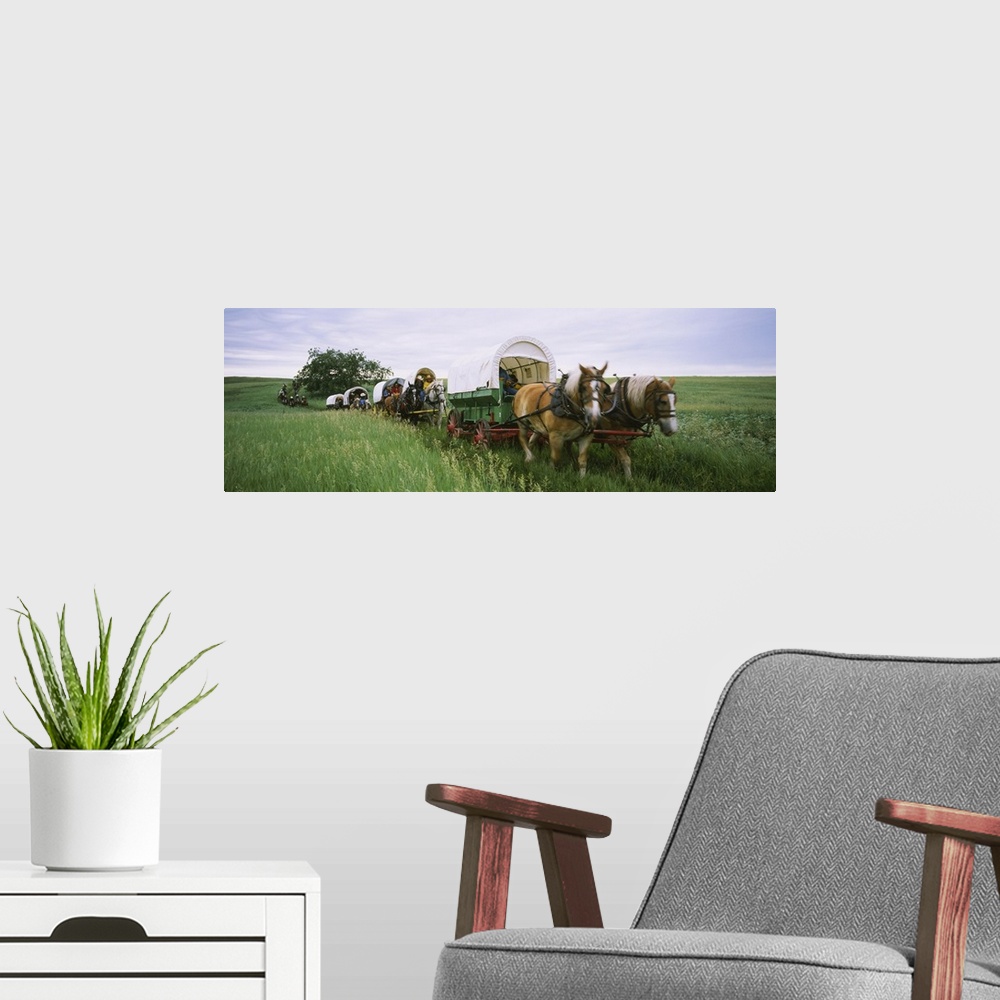 A modern room featuring Historical reenactment, Covered wagons in a field, North Dakota