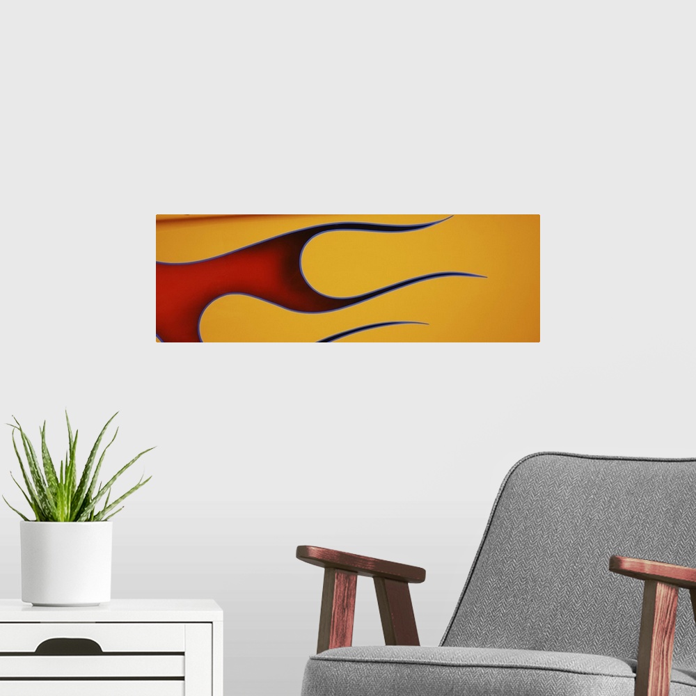 A modern room featuring Hot rod car with flame design