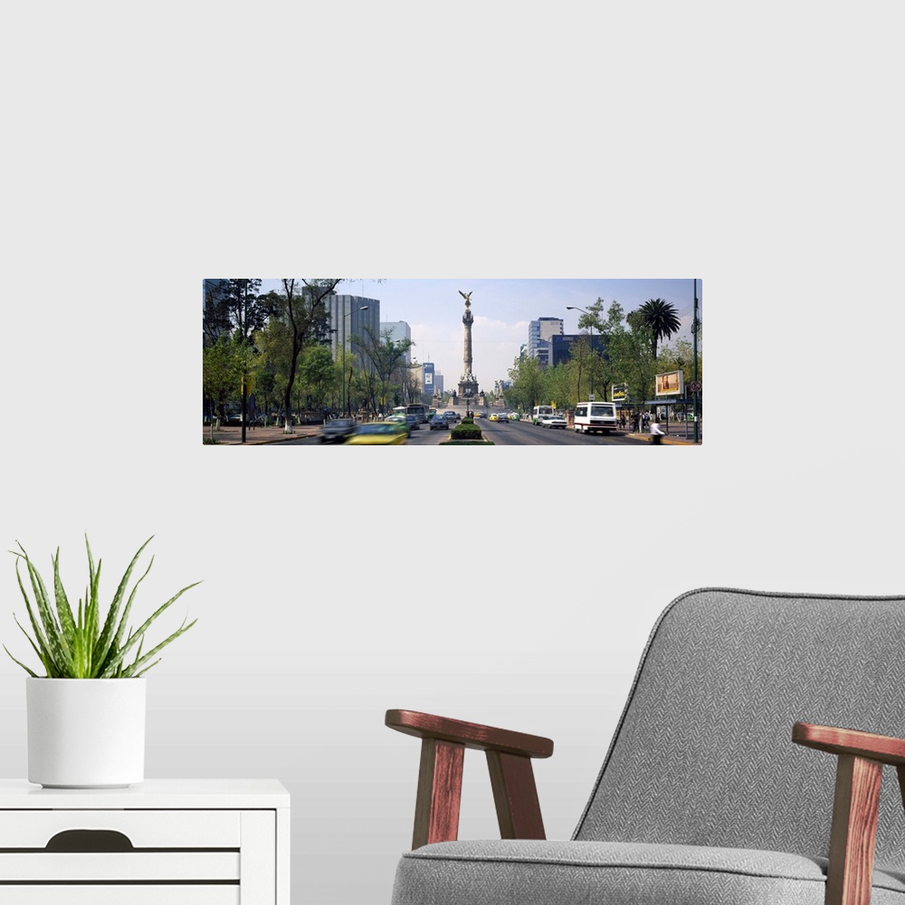 A modern room featuring Traffic on road with victory column, Independence Monument, Independence Circle, Paseso Del La Re...