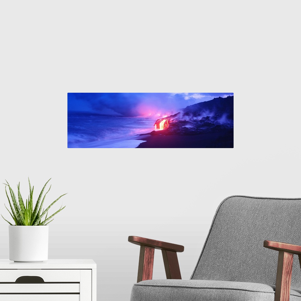 A modern room featuring This panoramic photograph was taken at twilight and focuses on the glowing magma as it meets the ...